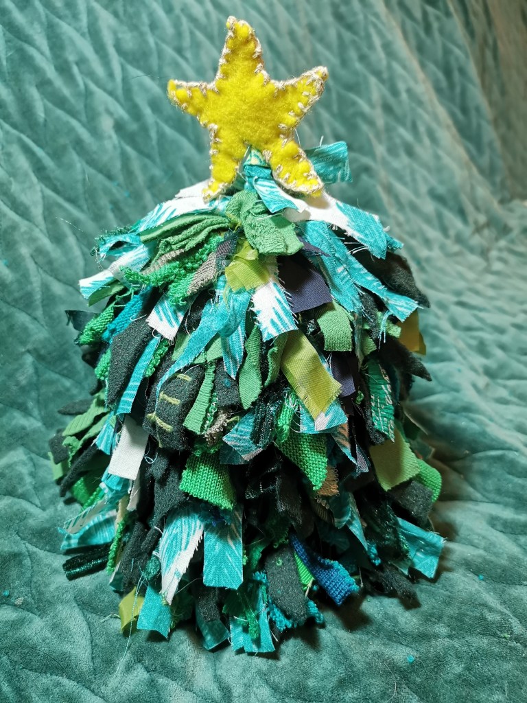 The final item. There is a kebab stick down the middle of the tree that goes up into the star.